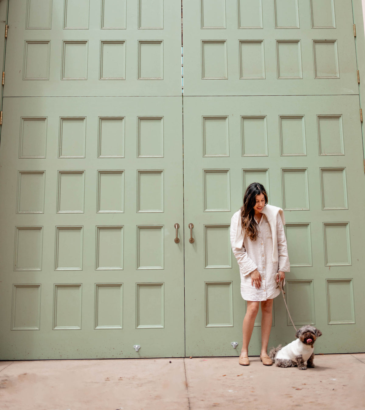 warmthe owner and her dog wearing the ivory cable knit sweater