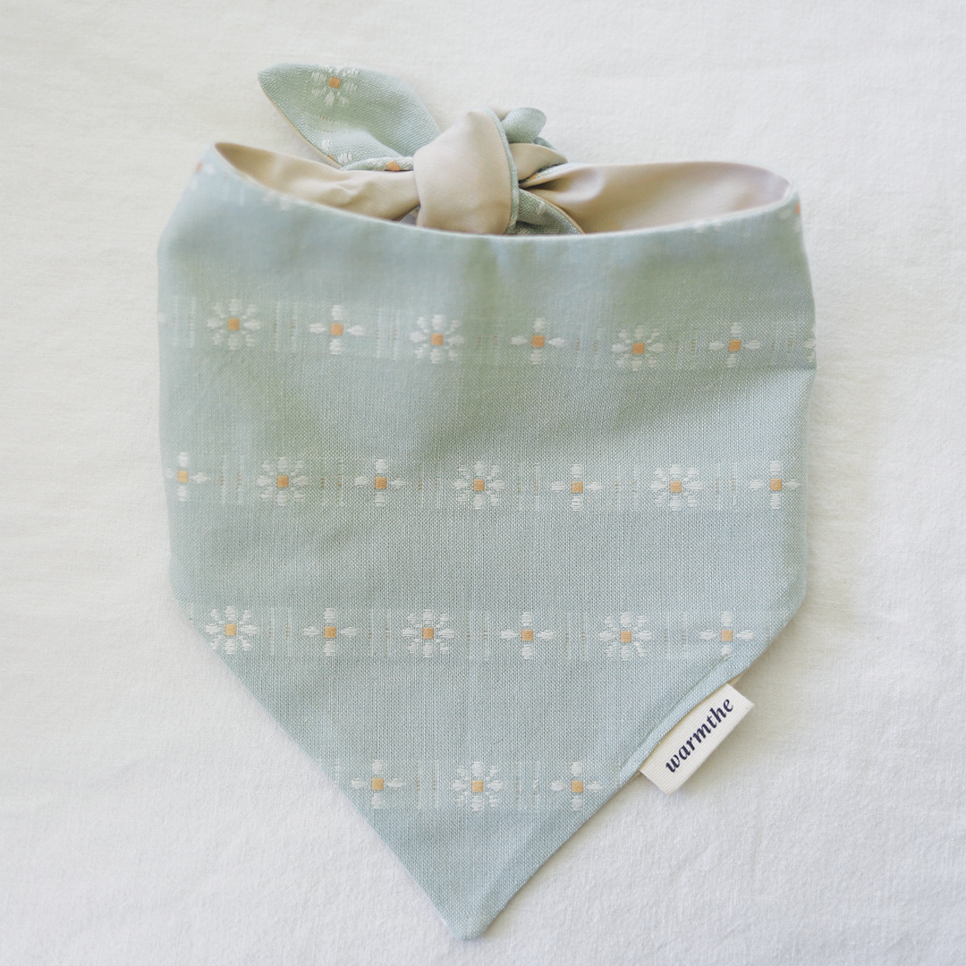 Sage Daisy: Sage Daisy cotton dog bandana with embroidered daisy stitching, tied and laid flat, handmade by warmthe